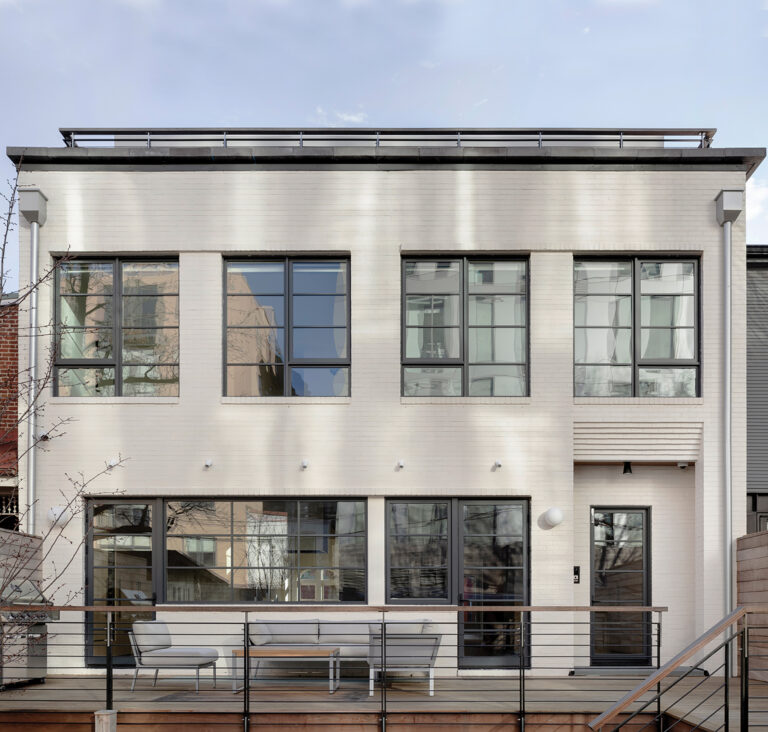 Two townhouses were joined and seamlessly unified with a rear addition overlooking an urban garden.
