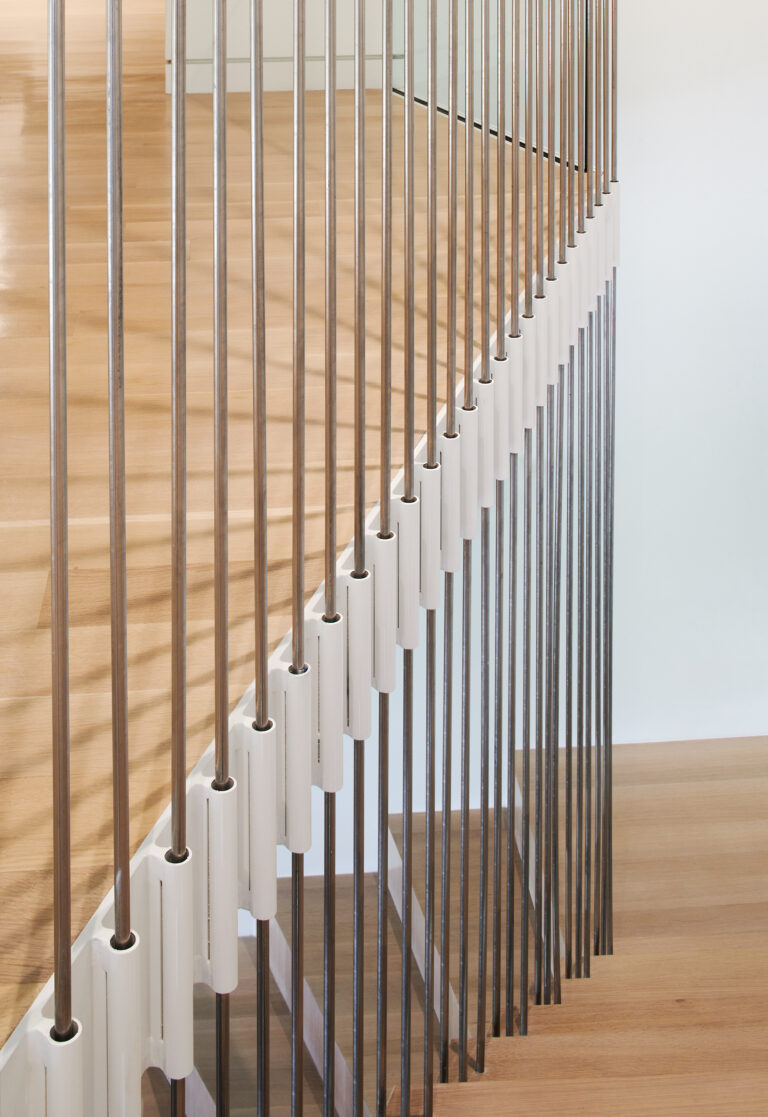 While renovating a 3,900-square-foot, two-level apartment on Dupont Circle, the architects designed the stair as a series of cantilevered parallelogram treads.