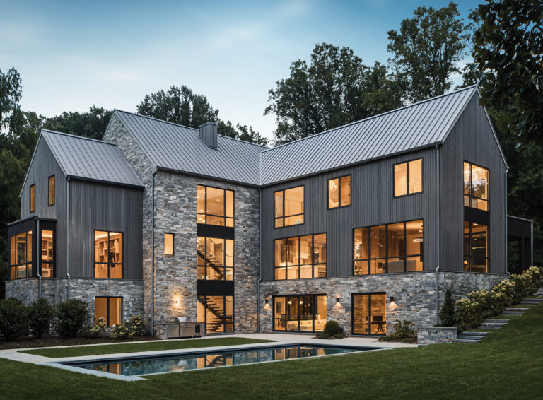 Simple forms define a modern home composed of intersecting gables.