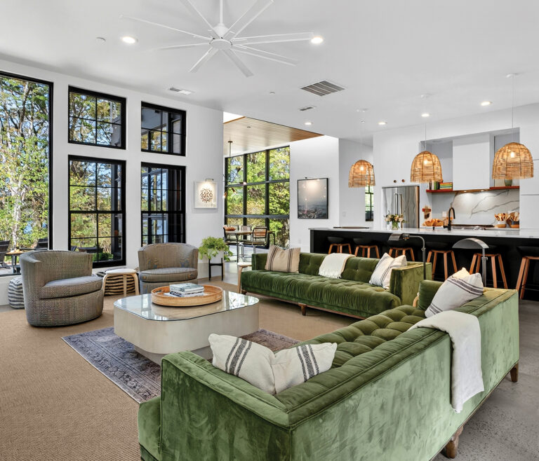 The open-plan living, kitchen and dining spaces all center on the expansive lake vista.