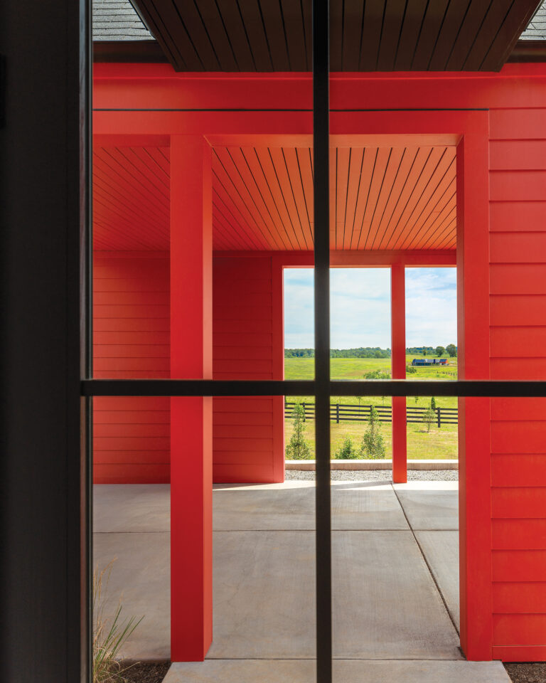 A linear entry connects the living and bedroom pavilions with the third volume, containing a carport/sheltered patio.
