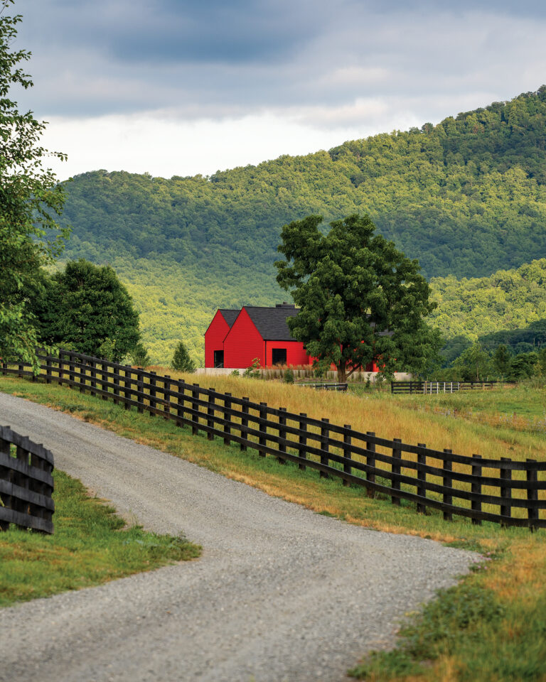 Architecture intersects with nature in a landscape dotted with agrarian structures.
