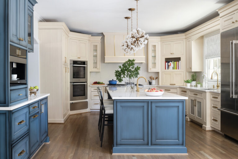 In a Bethesda kitchen, two-tone custom cabinetry is paired with quartz countertops and backsplash.