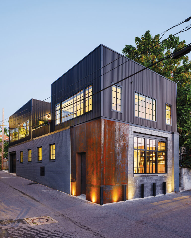 Corten steel, cinderblock and corrugated metal detail a home reimagined in industrial style from a DC warehouse.