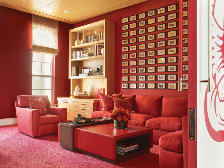 Jay Jenkins used the concept of color washing in a warm, enveloping den; 150 antique prints of butterflies hung in a contemporary grid allowed for scale, color and interest.