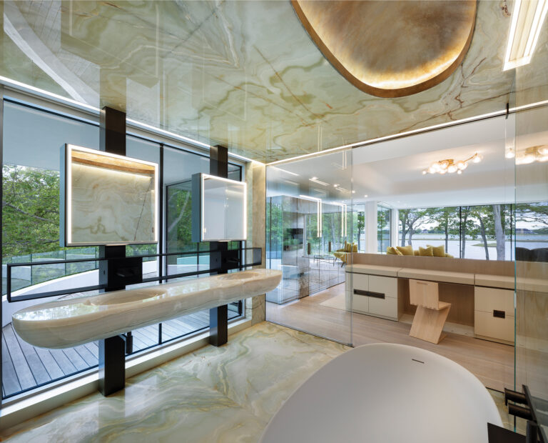 Green onyx blocks, raw unfinished cedar, honed Lasa stone and hand-patinated bronze conjure a luxe and unexpected bathroom.