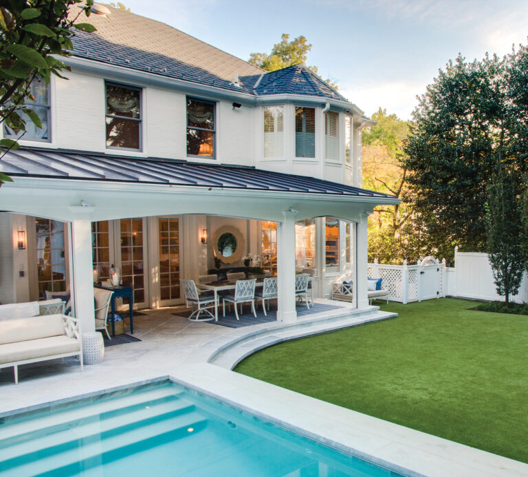 A gracious porch adds character and ambiance to a poolscape and lawn.