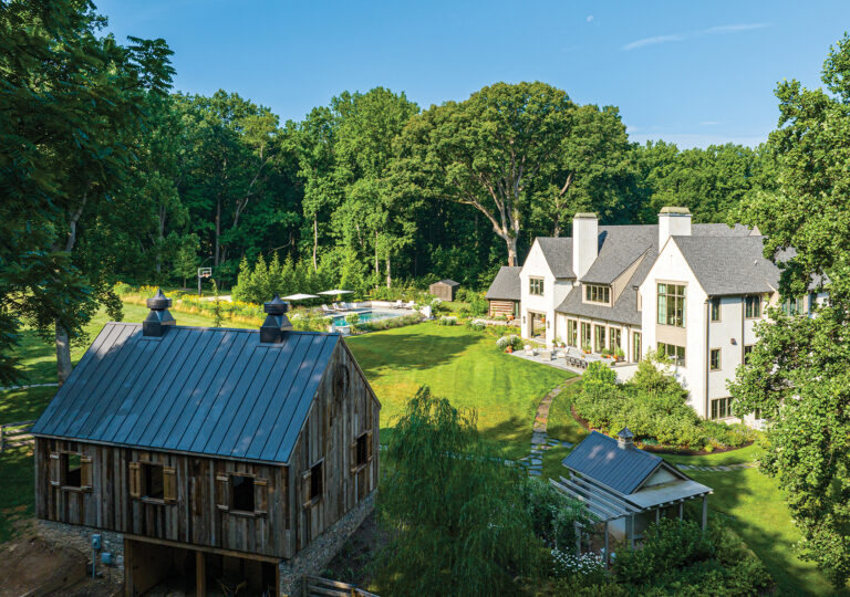 A seven-acre Vienna property is home to a residence, historic log cabin, pool terrace, potager, barn and chicken coop.