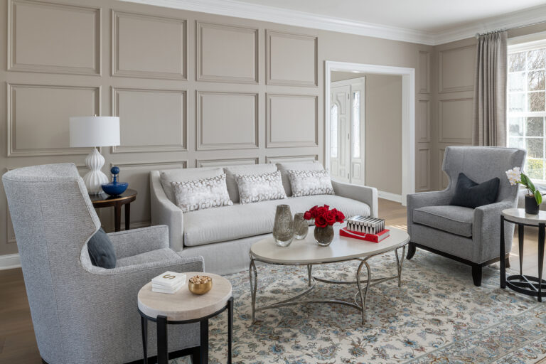 Elegant living balanced with timeless architectural detailing featuring soft, layered textures and refined furnishings.