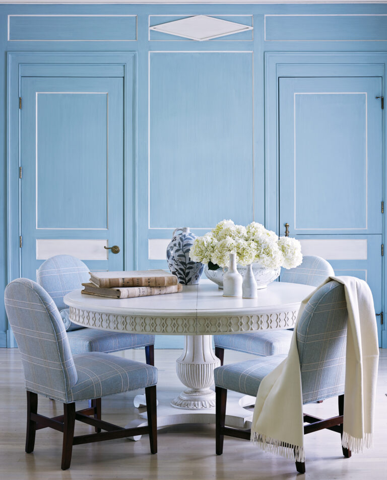 Renovating a 1920s home in Bethesda, Drysdale embraced a client’s favored midtone blue in the dining room, where the glazed hue covers walls, millwork and doors.