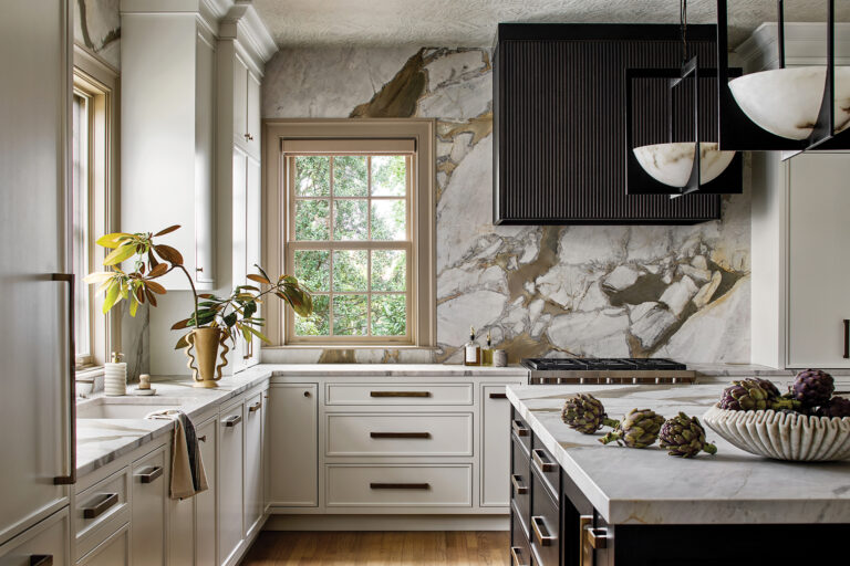 Newman collaborated with Tina Colebrook Kitchens on a luxe Annapolis kitchen for which she selected a dramatic stone backsplash and Kravet ceiling paper.