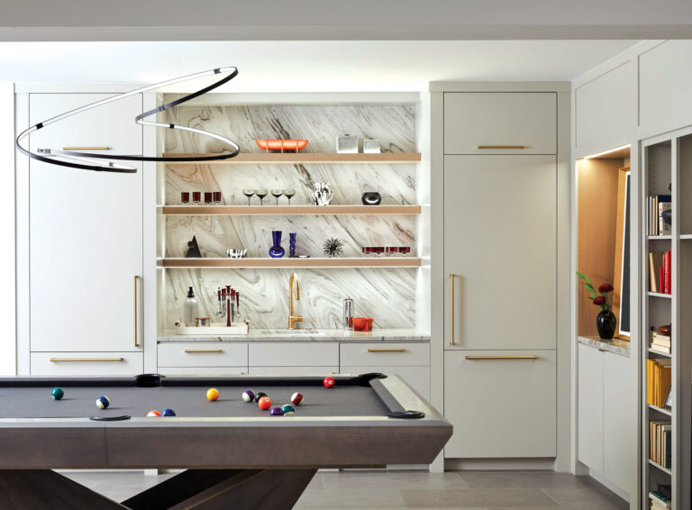 A pool-cue rack disguises the door to the hidden speakeasy room.