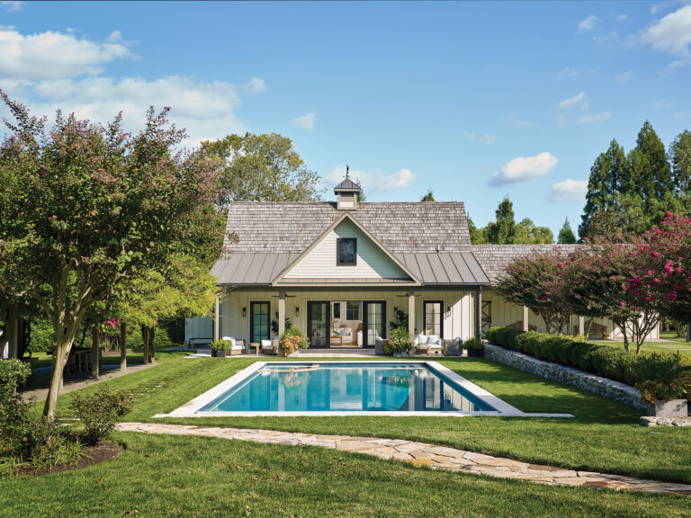 A renovated barn in Potomac was reimagined as a pool/guest house; cedar-shake roofing, board-and-batten siding and a new cupola transformed the structure.