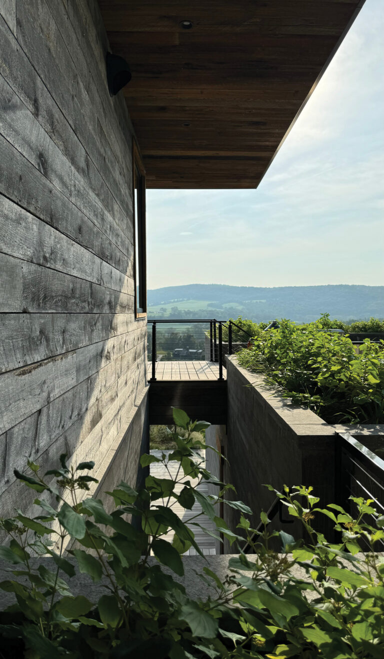 A residence at Silo Ridge in Amenia, New York, is defined by stacked volumes and deep overhangs.