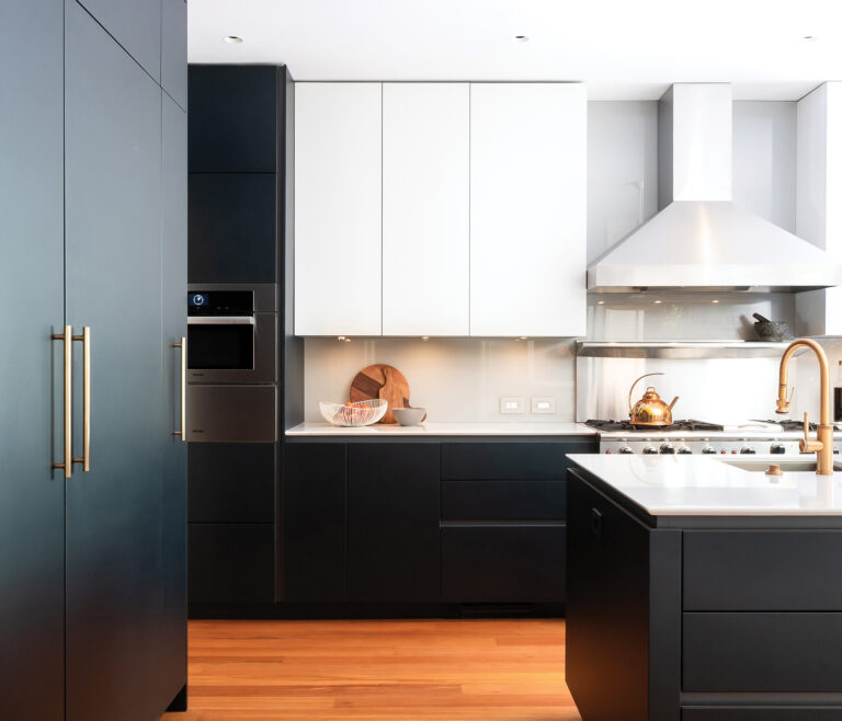 Floor-to-ceiling Snaidero cabinetry in dark blue lacquer and creamy white creates a high-functioning, streamlined Cleveland Park kitchen.