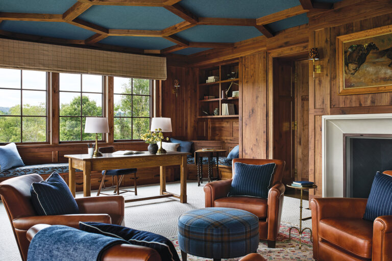 The inviting library/home office of a custom abode in Virginia Hunt Country—a collaboration with Marika Meyer Interiors—is clad in warm wood tones.