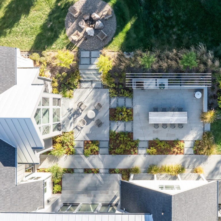 Anchor PictuSeen from above, ribbons of planting and carefully positioned terraces establish a clear framework that organizes movement, views, and outdoor living across the site.res