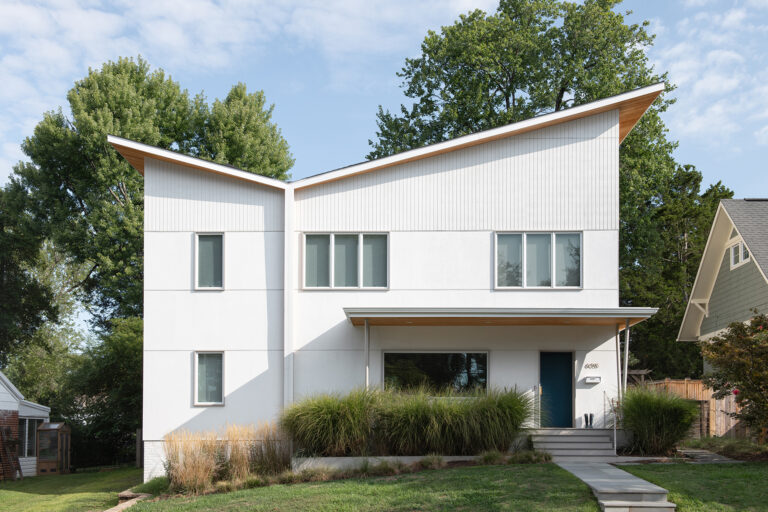5. Distinctive angular rooflines lend sculptural character to the home’s facade, pairing clean modern lines with subtle warmth and a thoughtfully integrated landscape.