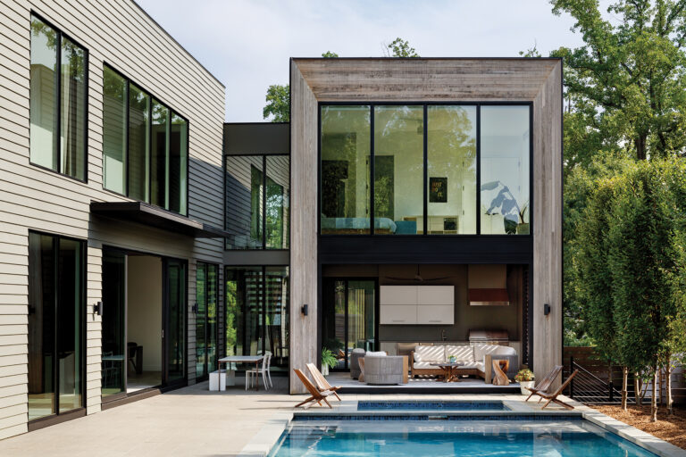 Within an open-air pavilion, the kitchen balances performance and polish for seamless outdoor, poolside entertaining.